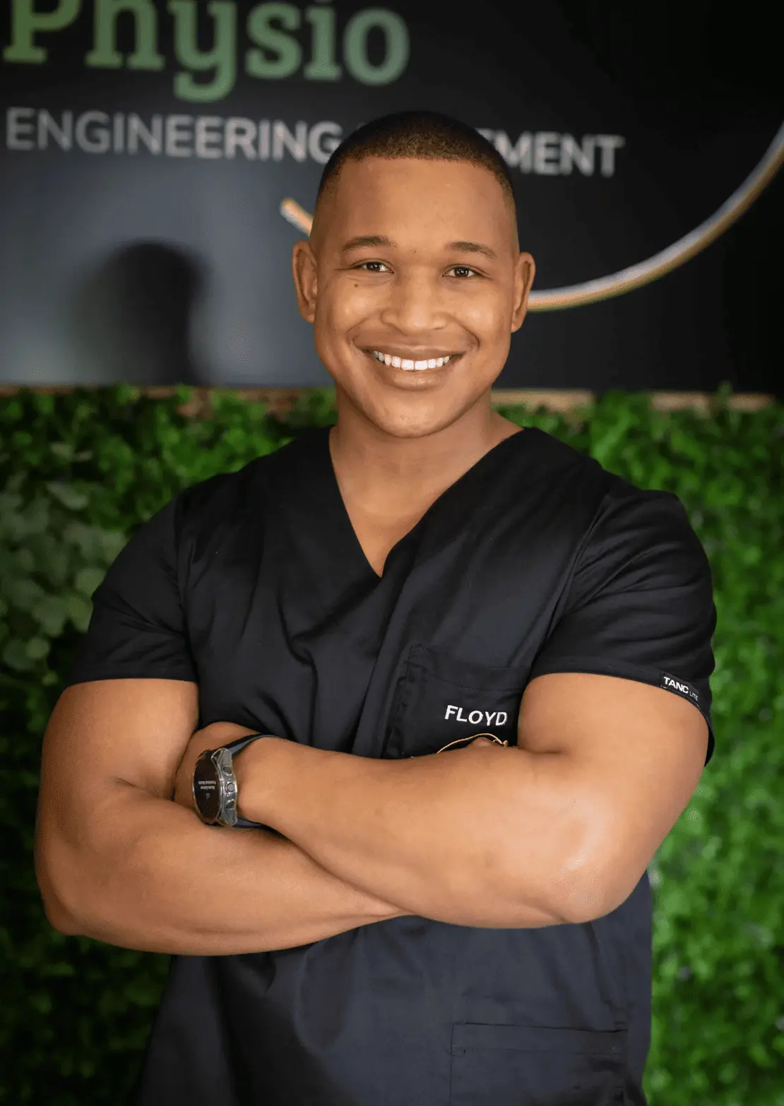 Floyd Lebatie, founder and sports physiotherapist at Midrand clinic, wearing black clinical scrubs